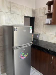 Kuchyň nebo kuchyňský kout v ubytování Baobab 2B, Bamburi + 10 fotografií