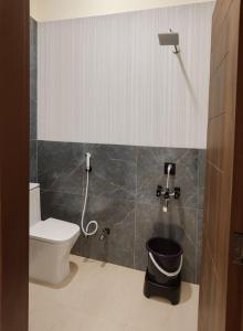a small bathroom with a toilet and a shower at Hotel SoT Intn premium Near TajMahal in Agra
