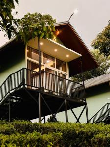 a balcony of a house with a window at Arvion Holidays in Vagamon +13 photos