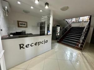 a store with arecipapa sign on the front of a store at Villa Stary Kalisz in Kalisz