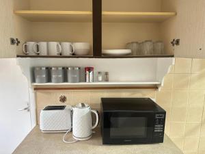 Η κουζίνα ή μικρή κουζίνα στο Cosy 3 bedroom house