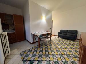 a living room with a table and a couch at Salentini house in Lecce