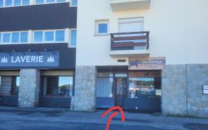 an orange ribbon is in front of a building at Appartement Pyrénées 2000 in Bolquere Pyrenees 2000