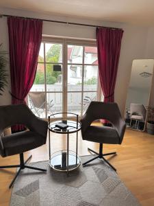 Χώρος καθιστικού στο Ferienhaus Weilheim mit Garten Spiel und Spass