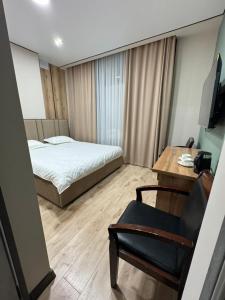 Postel nebo postele na pokoji v ubytování Mokk Hotel