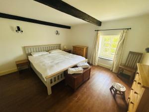 En eller flere senge i et værelse på Bailey Glace Farmhouse Monmouth