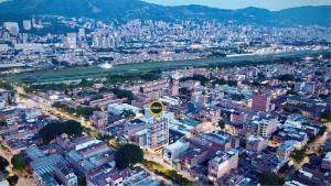 an aerial view of a large city with buildings at Akela30 Hotel in Medellín