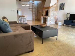 a living room with a couch and a coffee table at Holiday Home Ava1 with pool & Holiday Home Ava2 with whirlpool in Baderna