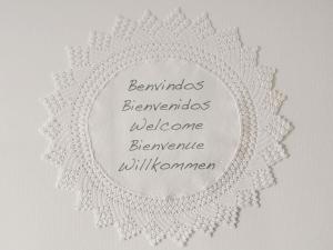 a circular embroidery hoop with a white lace border at Yellow House in Tavira +66 photos