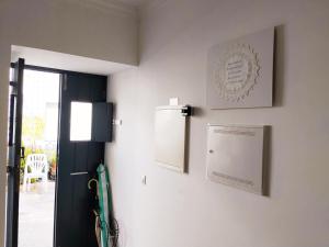 a room with two pictures on the wall at Yellow House in Tavira