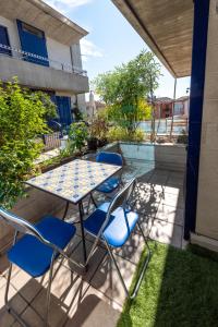 a table and chairs sitting on a patio at Tomati's House in Alba