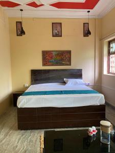 a bedroom with a large bed in a room at Hotel rama inn in Lucknow