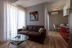 a living room with a couch and a glass table at Villa Veronika in Omiš