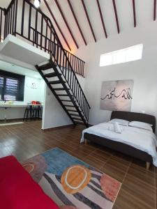 a bedroom with a bed and a spiral staircase at De'5 Tiny House , Besut in Kampong Kubang Bemban +7 photos