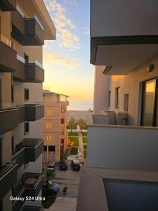 a view of a sunset from a balcony of a building at Nova Apartaments Qerret ZL in Golem