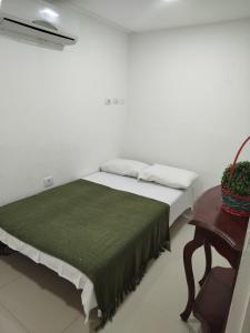 Ένα ή περισσότερα κρεβάτια σε δωμάτιο στο Sonia Flats Pipa's Bay - Flat 214