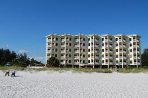 a large apartment building on the beach near the beach at Winter Sale on Now-Sunset Vistas 303N 100s 5 stars in St Pete Beach