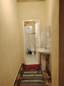 a bathroom with a sink and a toilet at Slow Tunis in Fayoum Center