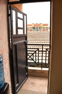 an open door with a view of a balcony at Divinehomes in Nairobi