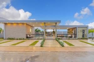 een groot gebouw met een trap op een parkeerplaats bij Private Villa in Punta Cana with Pool and Jacuzzi in Punta Cana