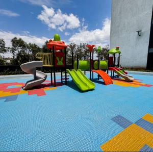a childrens playground with slides and a slide at SoulCare Haven in Syokimau