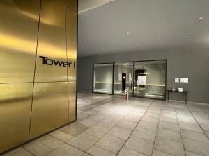 an empty lobby with a elevator in a building at Eclipse Residence in Cyberjaya