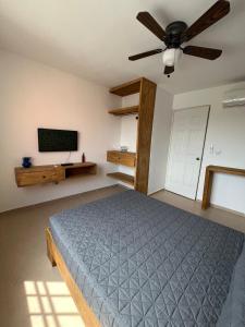 En eller flere senge i et værelse på Hermosa Casa en la Zona Industrial de Monterrey