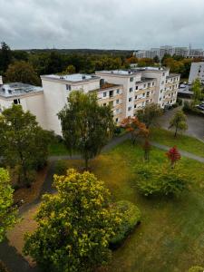 an aerial view of a building with trees and buildings at Kaiser-Rooms Stralsunder Ring 18 in Wolfsburg