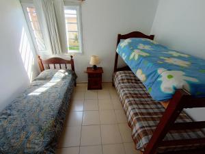a bedroom with two beds next to a window at CHALET DE VACACIONES i in Ostende