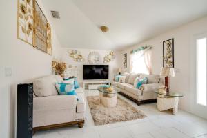 a living room with two couches and a tv at Elegance in Ocala Tranquil Home w Gazebo in Ocala