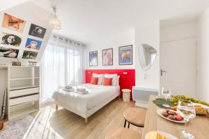 Ένα ή περισσότερα κρεβάτια σε δωμάτιο στο Appartement Suite BAUHAUS proche Paris