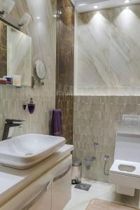 a bathroom with a white sink and a shower at Hurghada Sky Villa in Hurghada