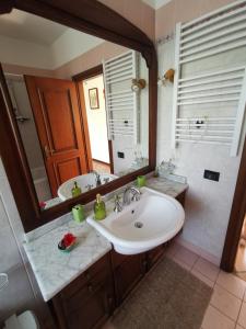 a bathroom with a sink and a large mirror at Vacanza nel boschetto in Narni +31 photos