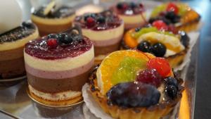 a bunch of pastries with fruit on a tray at Cristian BV Booking in Cristian