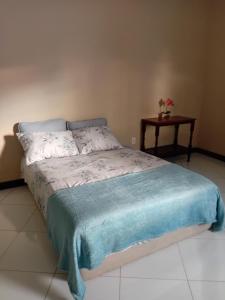 En eller flere senge i et værelse på Casa Branca