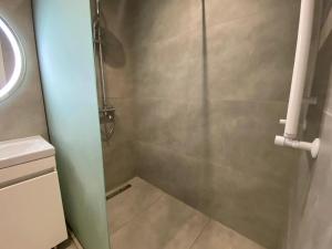 a shower with a glass door in a bathroom at Chișinău Arena in Chişinău +17 photos