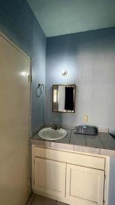 a bathroom with a sink and a mirror at Cozy Rooms Near Beach Puerto Peñasco Rocky Point in Puerto Peñasco +24 photos