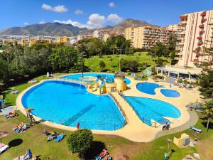 an overhead view of a large swimming pool in a city at Jupiter Apartments Sea View in Benalmádena