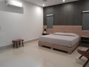 Ένα ή περισσότερα κρεβάτια σε δωμάτιο στο Lujosa Casa en Cumbres Elite