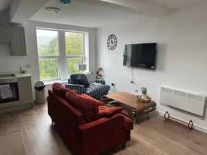 Μια τηλεόραση ή/και κέντρο ψυχαγωγίας στο Apartment 3 Shipley
