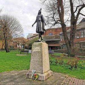 a statue of a woman standing in a park at Room in Swanscombe, Kent in Swanscombe +8 photos