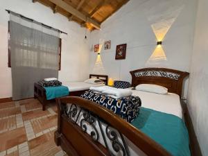 Ένα ή περισσότερα κρεβάτια σε δωμάτιο στο Casa & cabaña campestre equipadas, 13 personas, familias