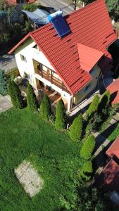 an overhead view of a house with a red roof at Casa Galbena in Slănic