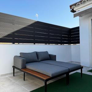 a blue couch sitting on top of a building at Casita Piedra Escrita - Private & Exclusive House in Córdoba