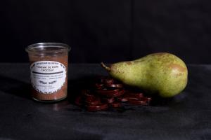 a jar of sauce next to a pear and a jar of jam at Holiday Inn Paris Opéra - Grands Boulevards by IHG in Paris