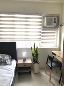 En eller flere senge i et værelse på Royal Garden Residences - Mabolo