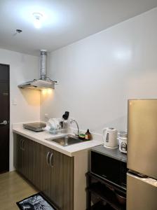 Kuchyň nebo kuchyňský kout v ubytování Lylo Pod at Vinia residences