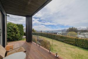 a view from the balcony of a house at Benmore Hideaway Cozy Room with Mini Kitchenette in Lake Tekapo +21 photos