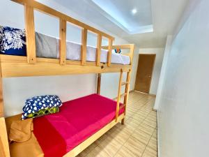 a bedroom with bunk beds in a house at Hostal Amate Taxco in Taxco de Alarcón +33 photos