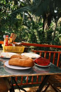 a table with plates of food on top of it at Homestay and Tour Ben Tre in Ben Tre